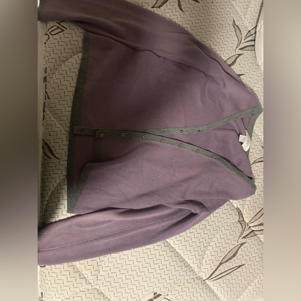 Light purple cardigan with a gray border.